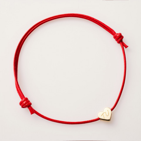 Bracciale in cordino rosso con cuore d’oro 18K e incisione TU
